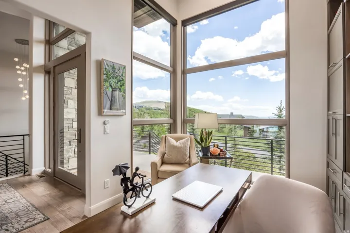 Floor-to-ceiling windows with expansive mountain scenery