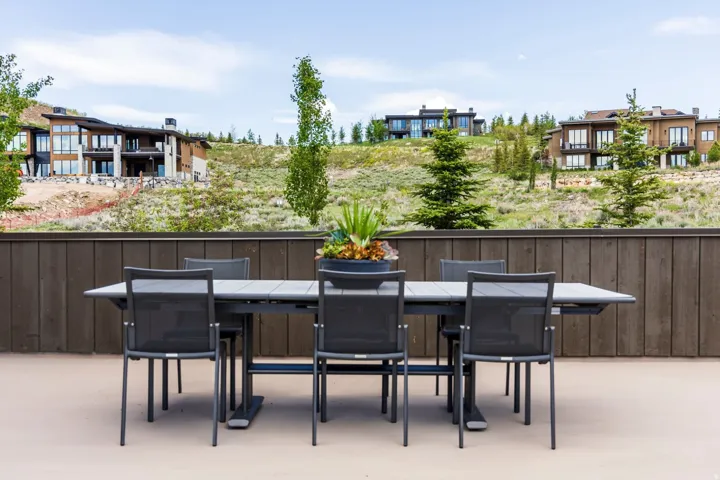 Expansive outdoor patio with a privacy fence