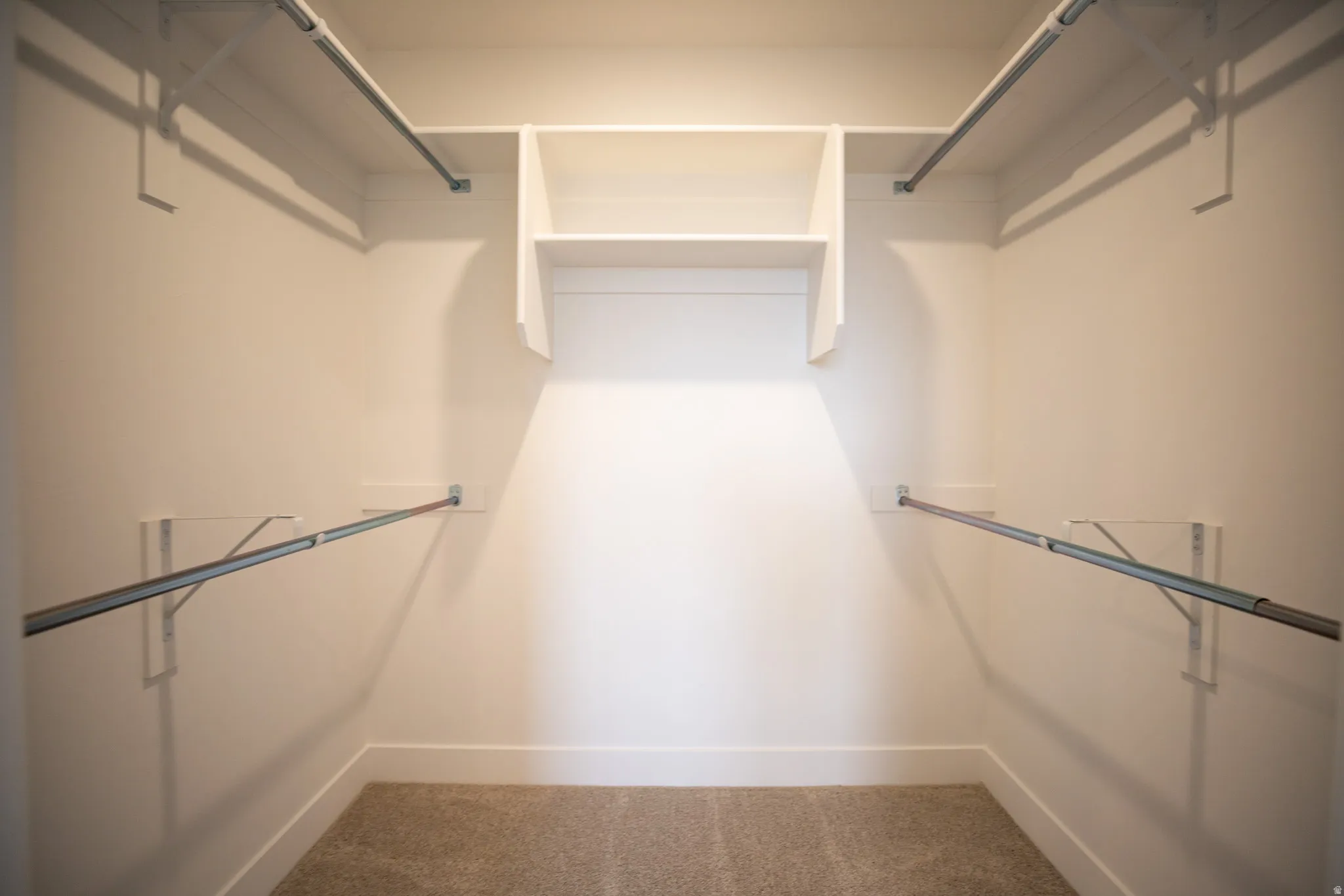 Primary bedroom walk-in closet