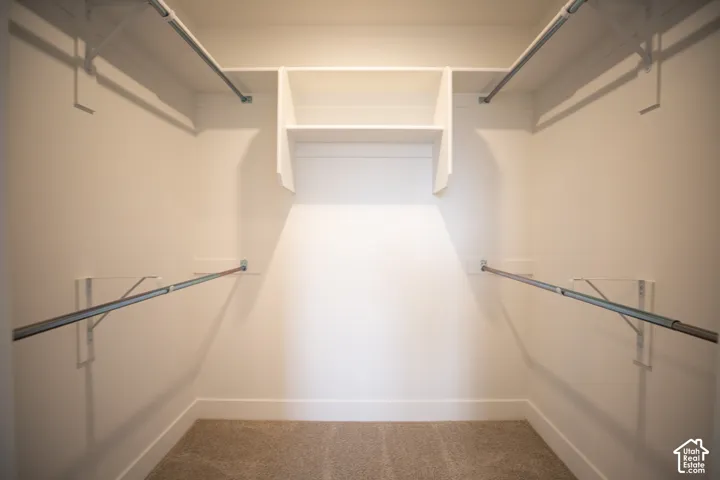 Primary bedroom walk-in closet