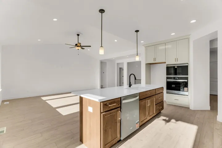 Kitchen island with integrated sink and dishwasher