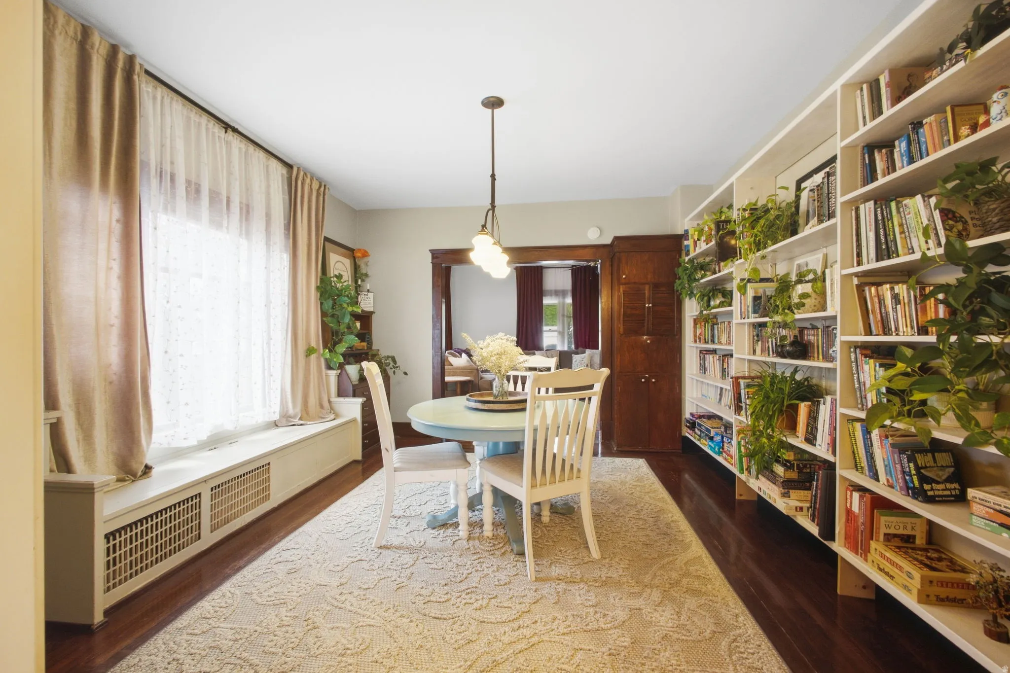 Rich wood-finish flooring with built in shelves, desk and charming window seat.