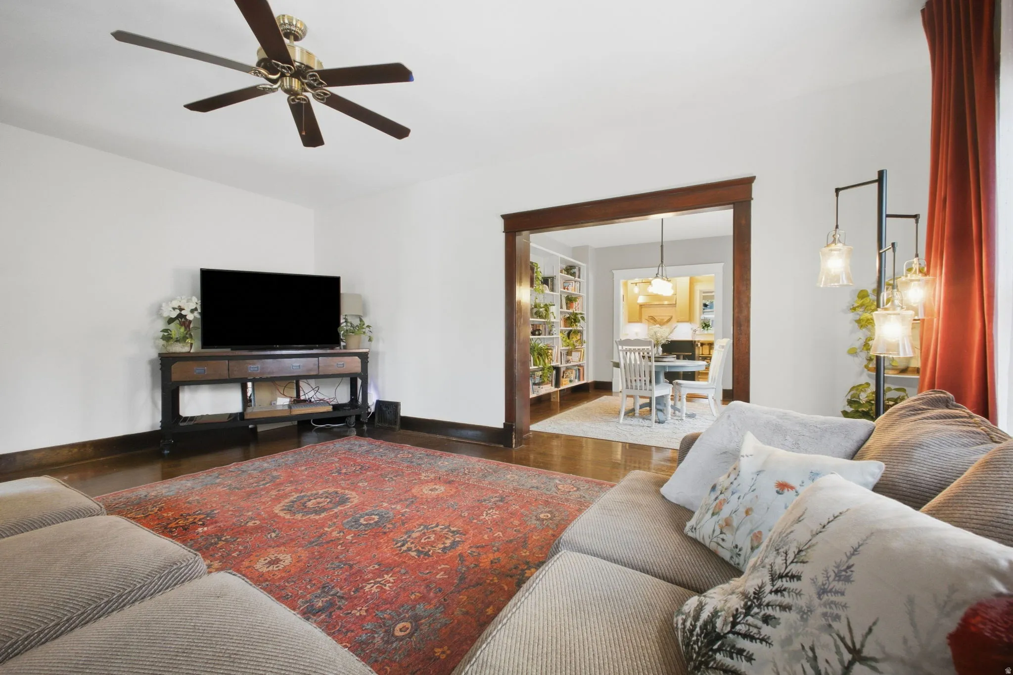 Spacious living room is open to an adjacent dining room and kitchen.