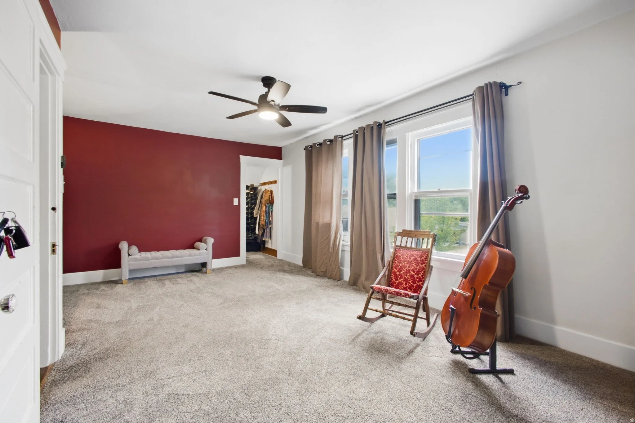 Large master bedroom featuring an abundance of natural light from multiple windows.