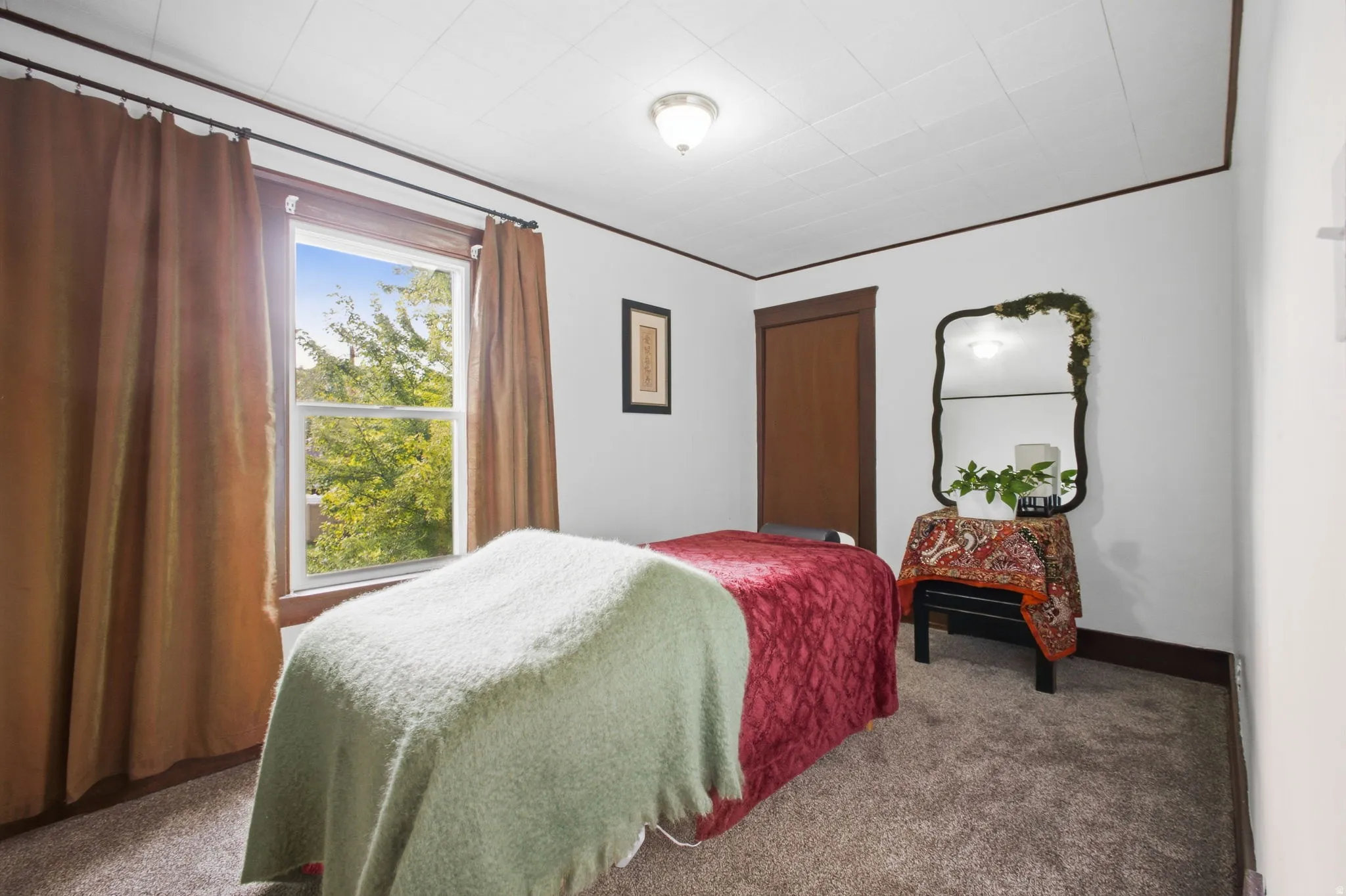 White walls with dark wood trim and plush carpeting.
