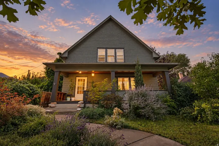 Covered front porch, and mature landscaping.