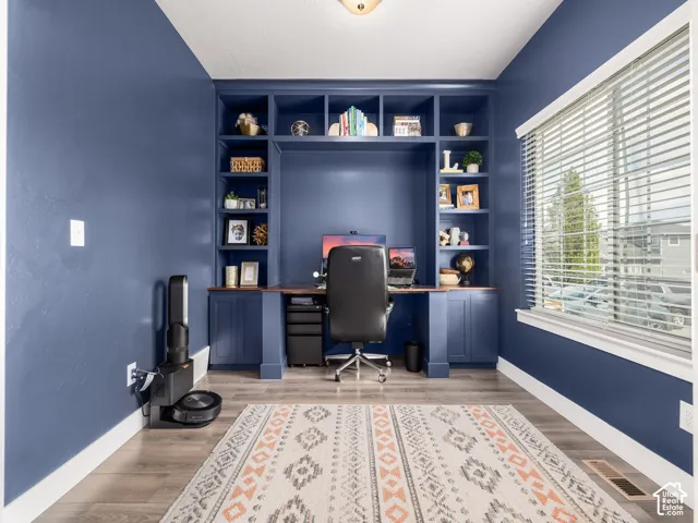 Built-in shelving and desk unit with rich wood-finish countertop
