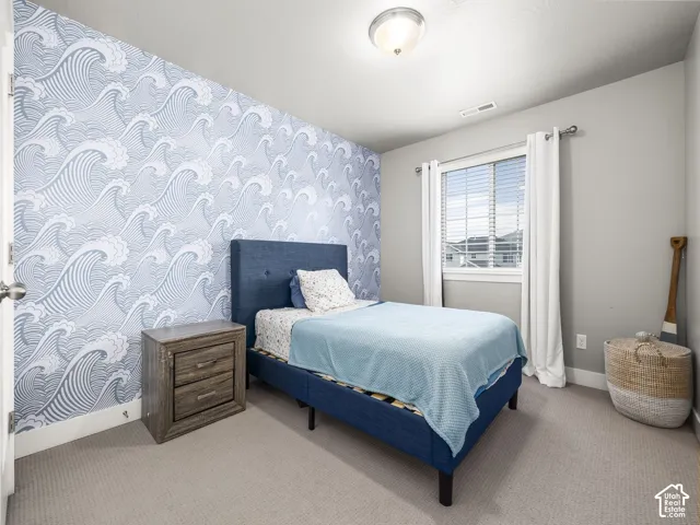 Accent wall featuring wave pattern wallpaper