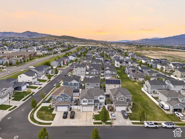 Expansive suburban neighborhood featuring numerous single-family homes with pitched roofs and manicured lawns