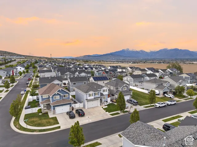 Residential neighborhood featuring a consistent architectural style, paved streets, and landscaped yards