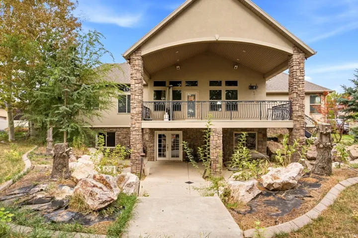 Multi-level stucco exterior with stone accents