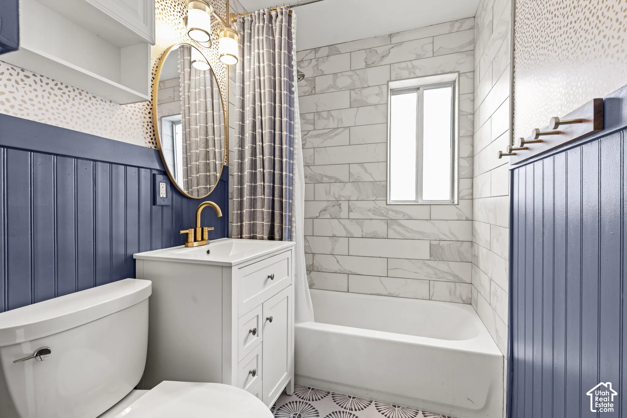 White vanity with gold-finish faucet