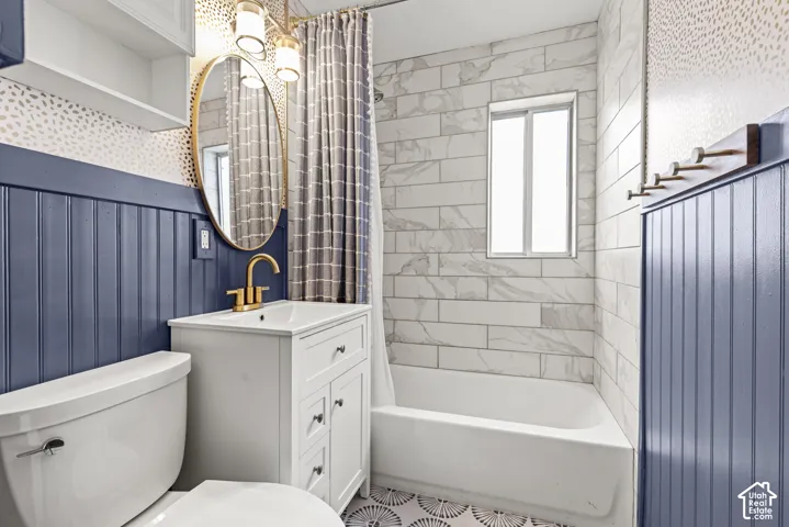 White vanity with gold-finish faucet