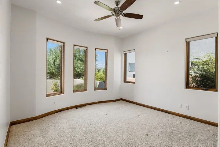 Room with carpeted flooring, a ceiling fan, and recessed lighting