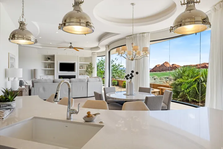 Open-concept living area with a built-in entertainment center, fireplace, and integrated shelving