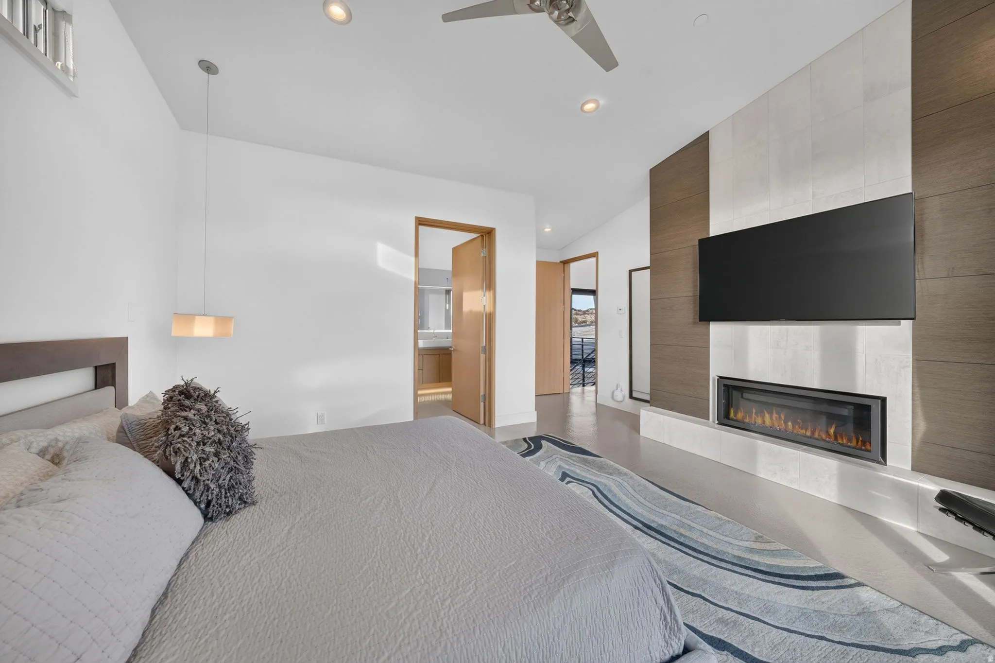 Integrated linear fireplace with a mounted television