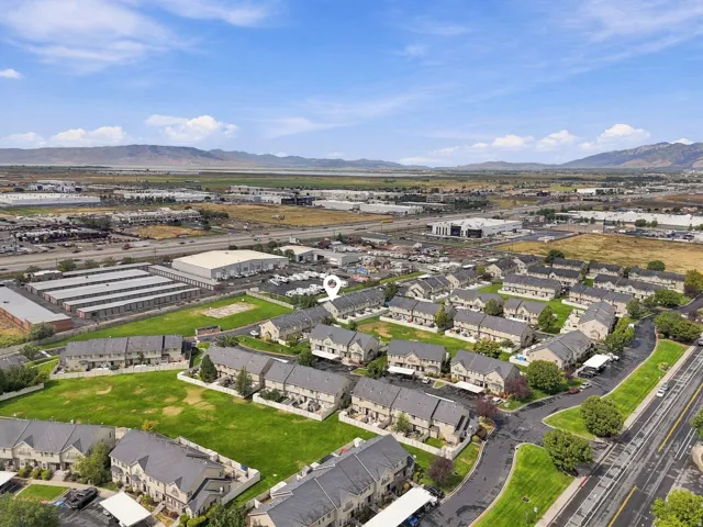 Townhome community with green spaces and mountain backdrop