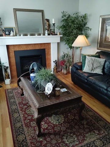 Built-in fireplace with a white mantel and tile surround