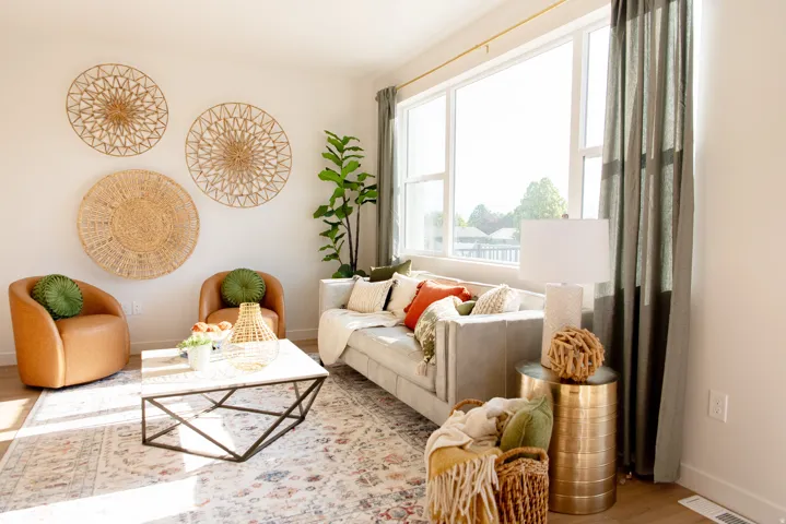 PICTURES OF MODEL- Expansive windows, light wood-finish flooring, and a neutral color palette define this living space