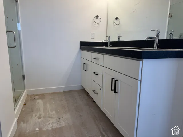 Dual sink vanity with white cabinetry and black hardware