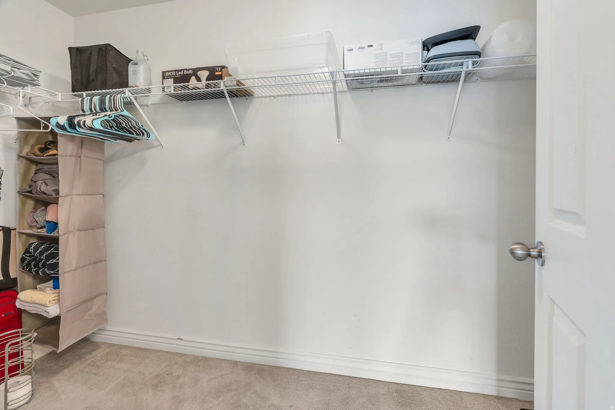 Wall-to-wall carpeting and white painted walls
