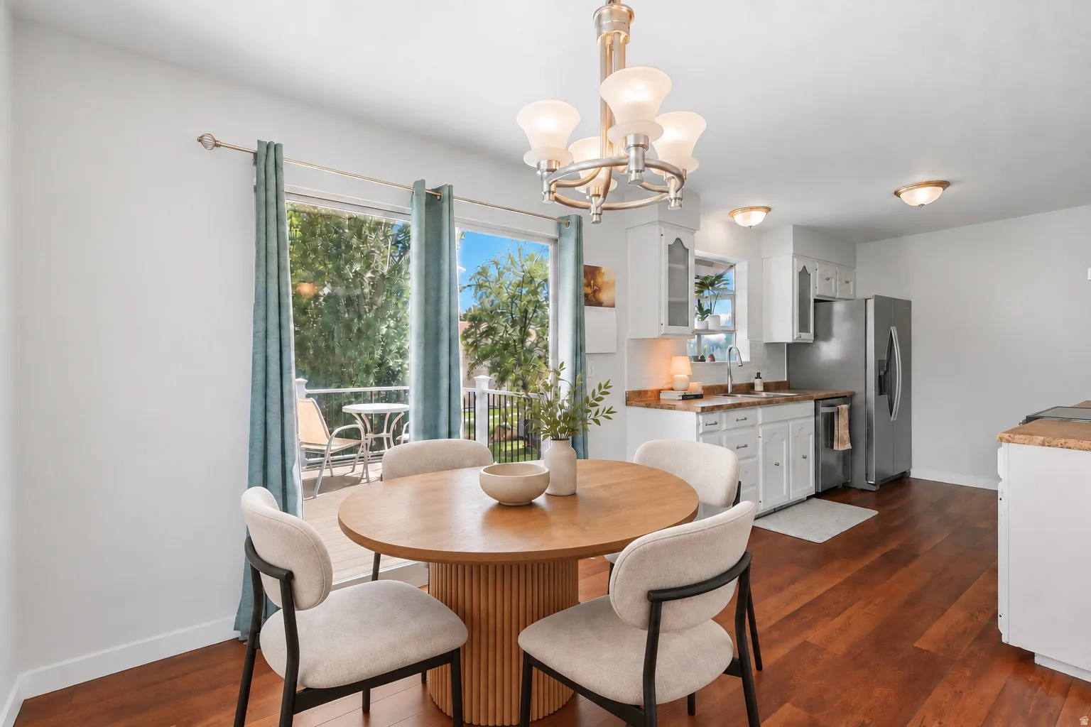 Wood-finish flooring throughout, bright white walls, and a recessed lighting fixture