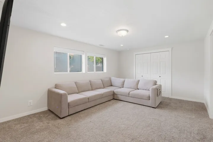 Plush carpeting, recessed lighting, double-pane windows, and a built-in closet with bi-fold doors