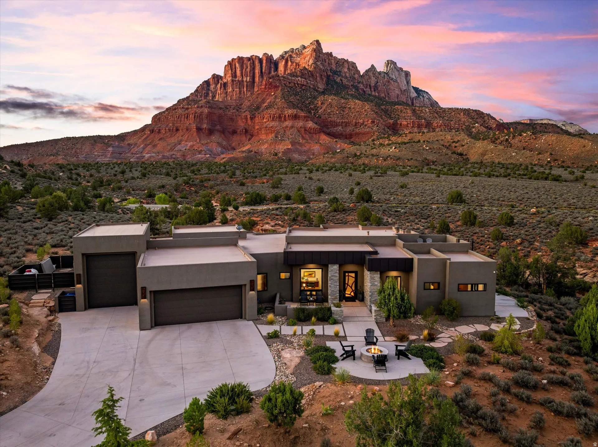 Full property, showcasing the extra-large 2-car garage plus a separate oversized RV/boat bay, with Mt. Kinesava framing the view.