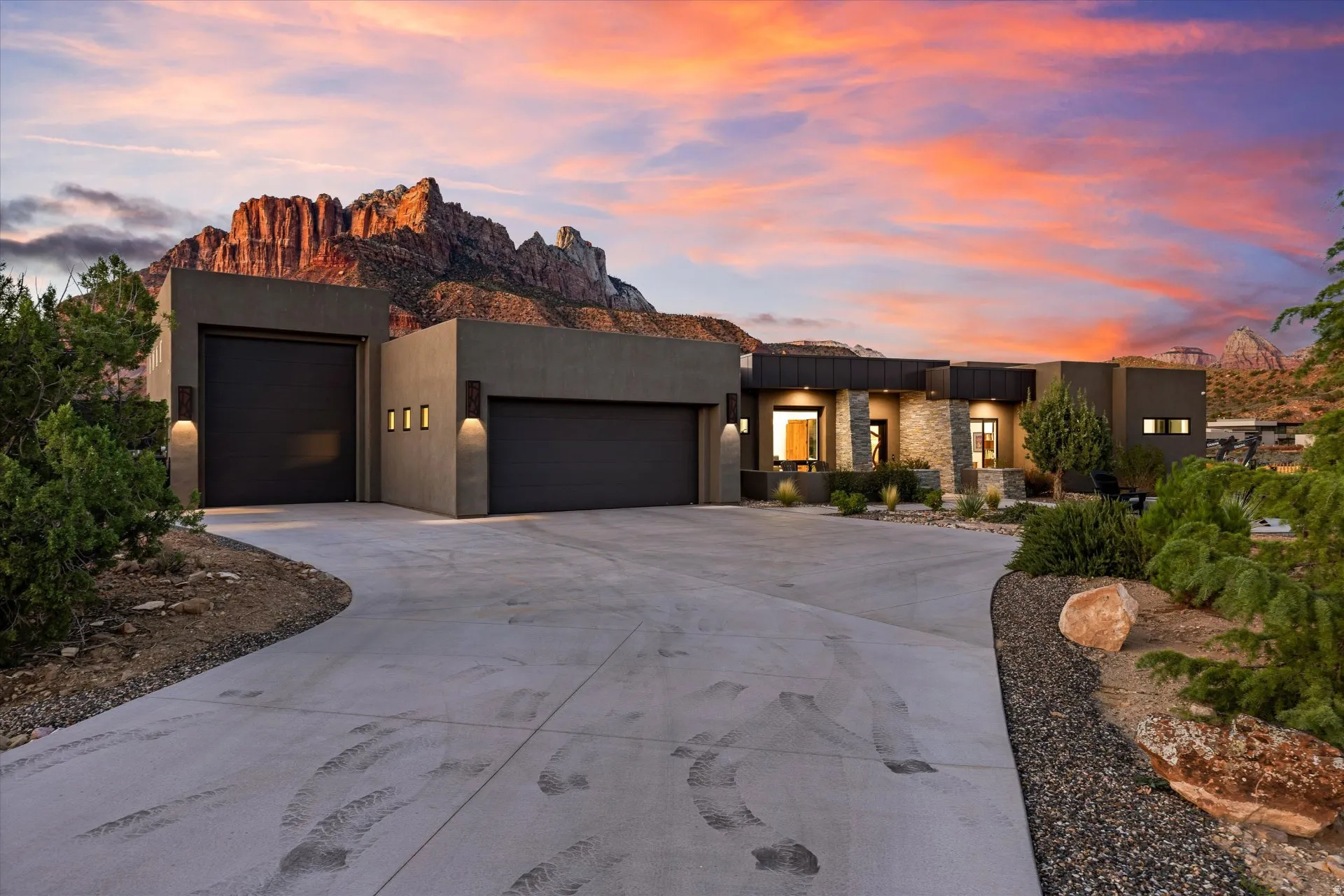 Extra-large 2-car garage plus a separate oversized RV/boat bay, framed by the profile of Mt. Kinesava. Both bays are served by a mini-split climate system, with two 220V/50-amp outlets and EV charging.