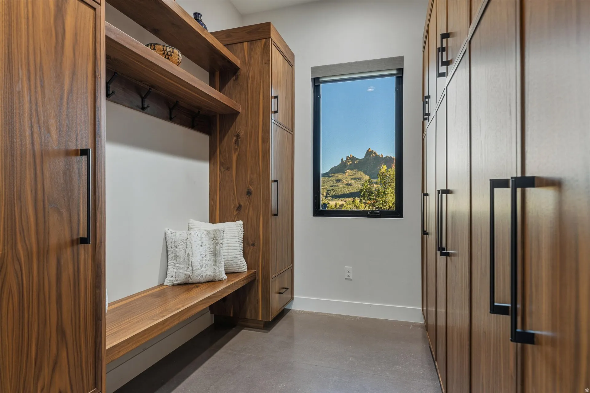 Mudroom with built-in lockers, a bench, and a view window.
