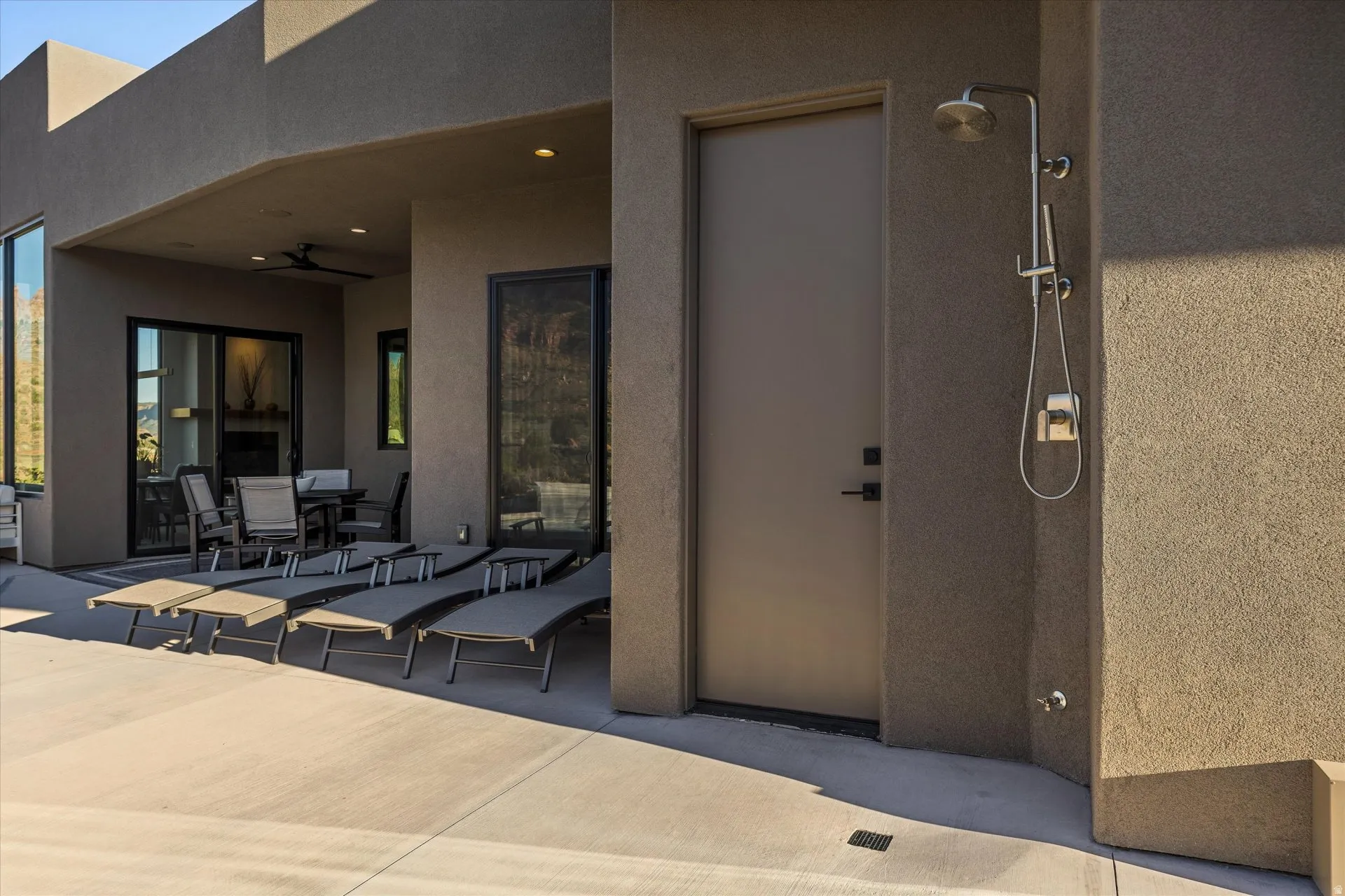 Outdoor shower with direct access to the pool-patio half bath.