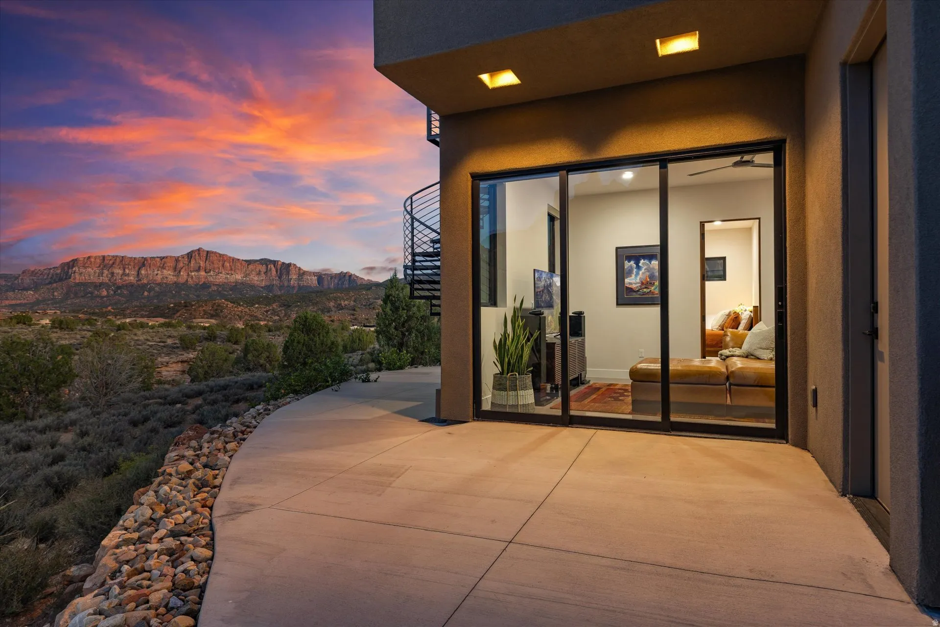 The guest wing opens directly onto the pool patio, framed by views of The Watchman and Mt. Kinesava.