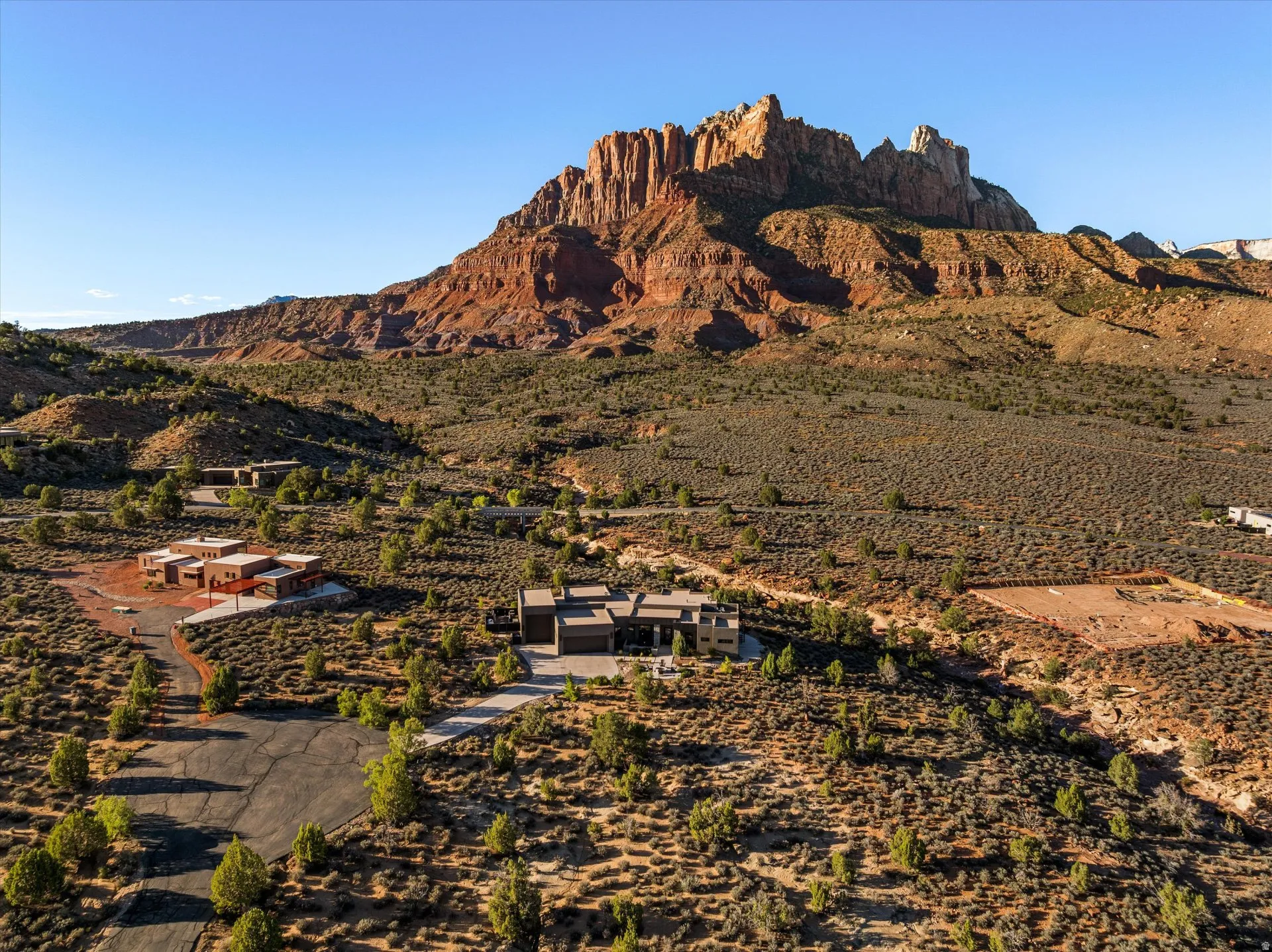 Aerial view of the home against Mt. Kinesava and the Anasazi Plateau.