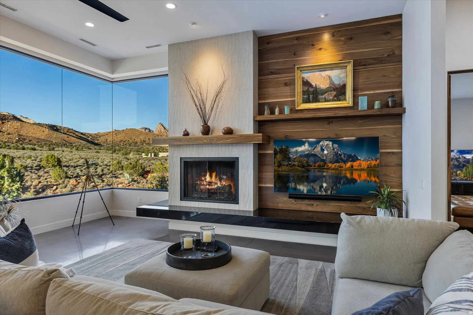 The living room centers around a custom fireplace with a walnut feature wall behind it.