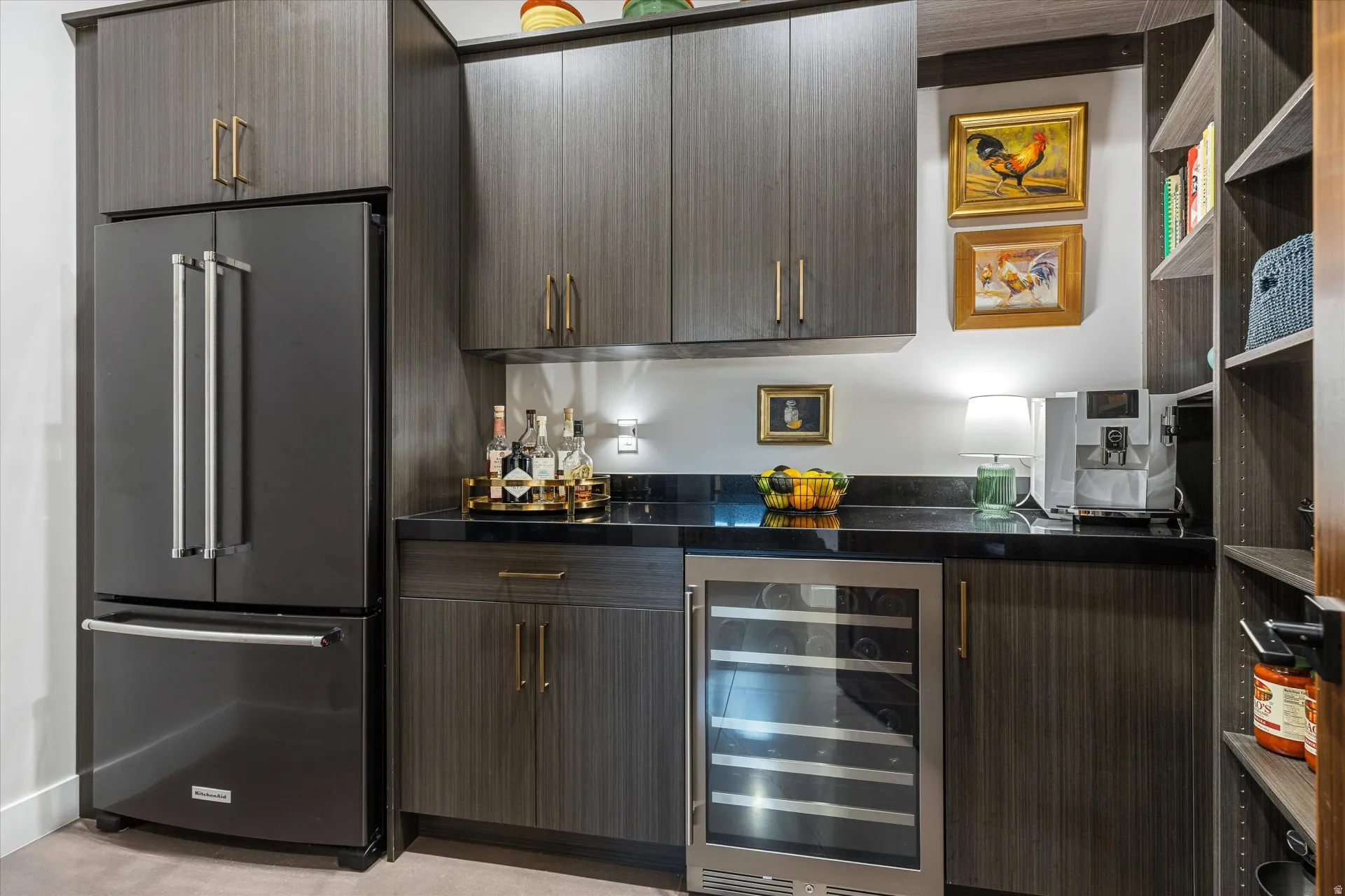 A butler's pantry tucked behind the kitchen adds a second refrigerator, wine fridge, and bar counter.