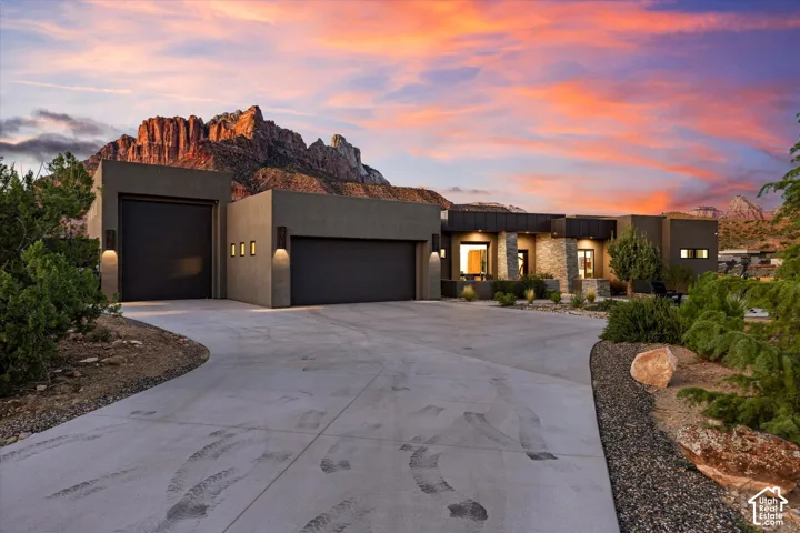 Extra-large 2-car garage plus a separate oversized RV/boat bay, framed by the profile of Mt. Kinesava. Both bays are served by a mini-split climate system, with two 220V/50-amp outlets and EV charging.
