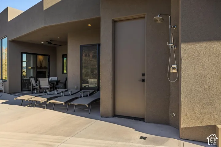 Outdoor shower with direct access to the pool-patio half bath.