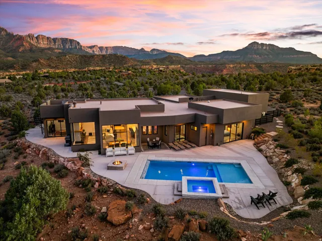 An aerial look at dusk shows the pool as a quiet centerpiece, set on over a third of an acre of open desert.