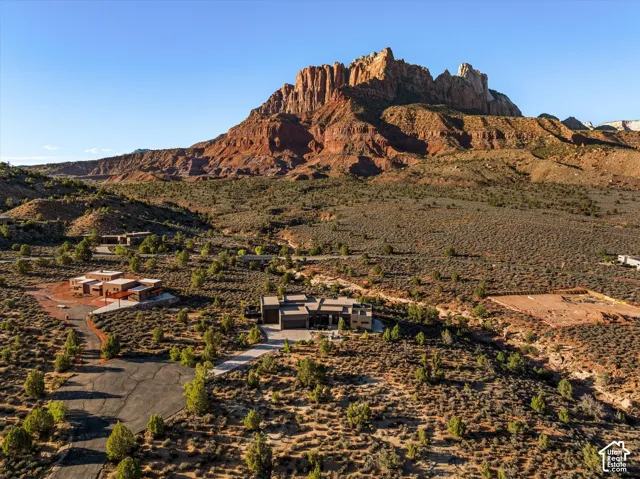 Aerial view of the home against Mt. Kinesava and the Anasazi Plateau.