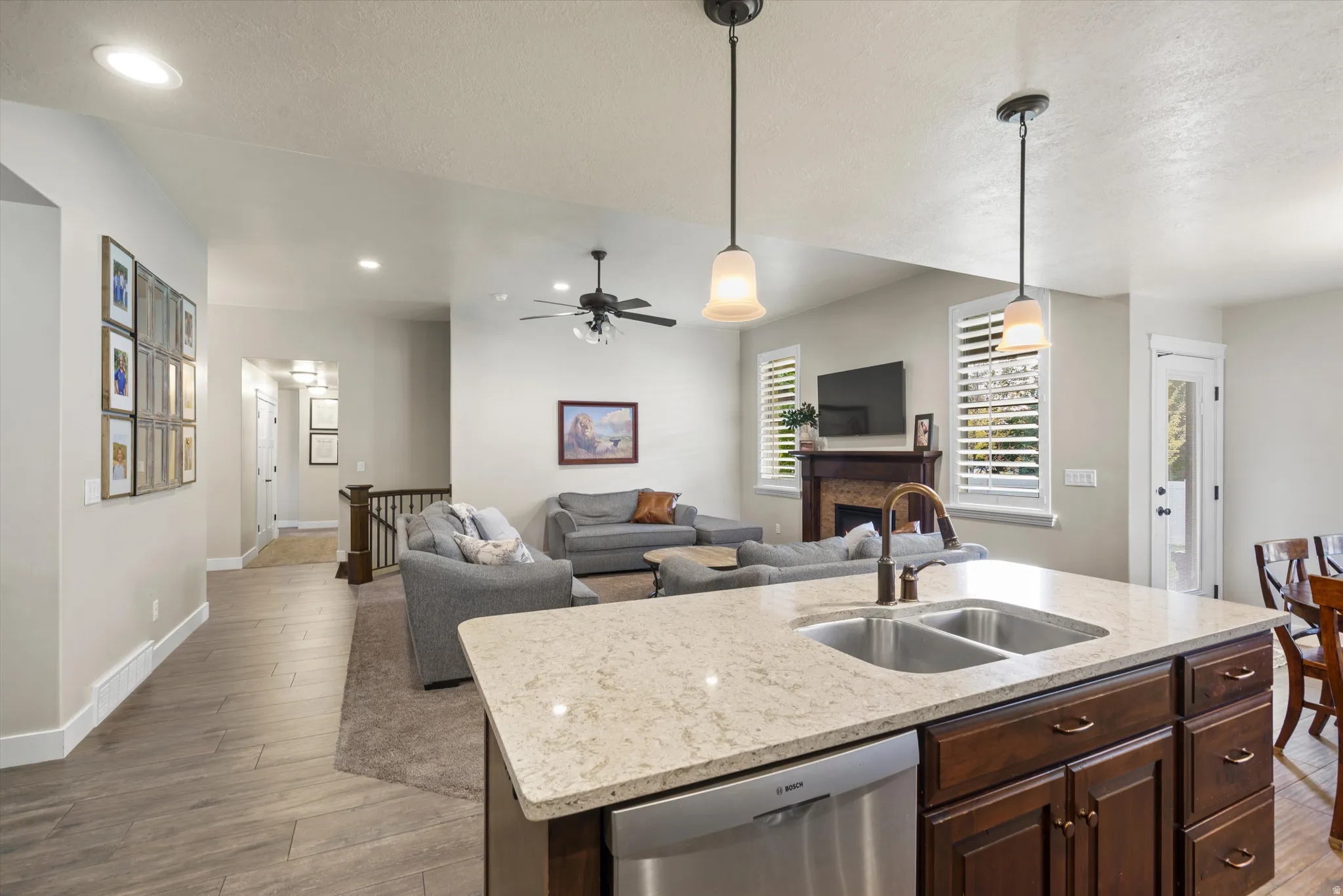 Kitchen island with stone countertop and dual basin sink