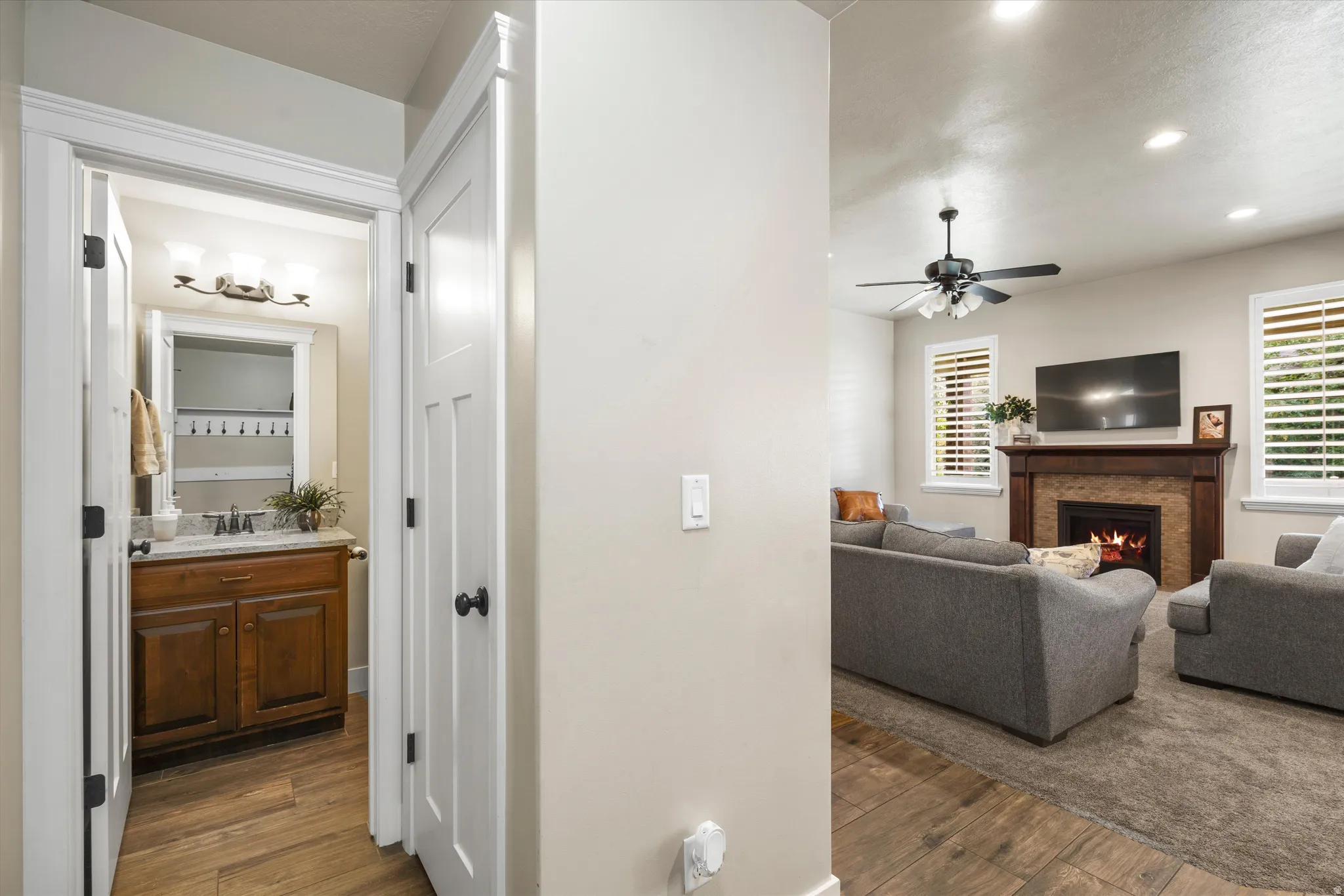 Living room with recessed lighting and a ceiling fan