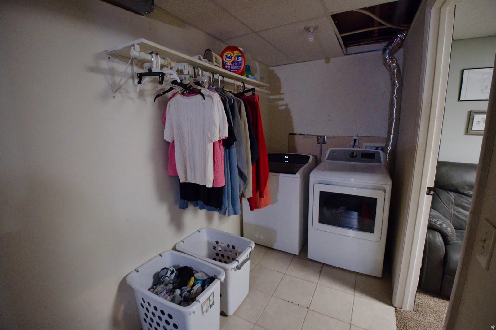 Tile flooring with contemporary washer and dryer appliances