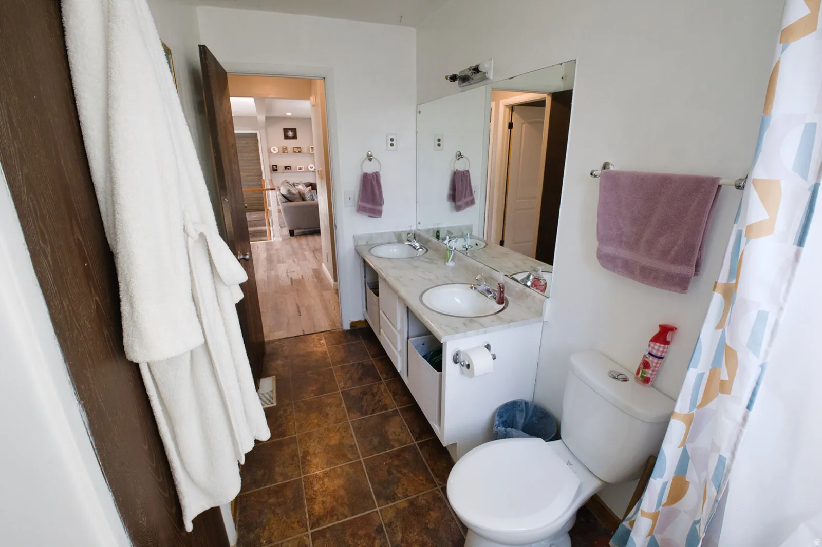 Dual vanity with undermount sinks and a wide mirror