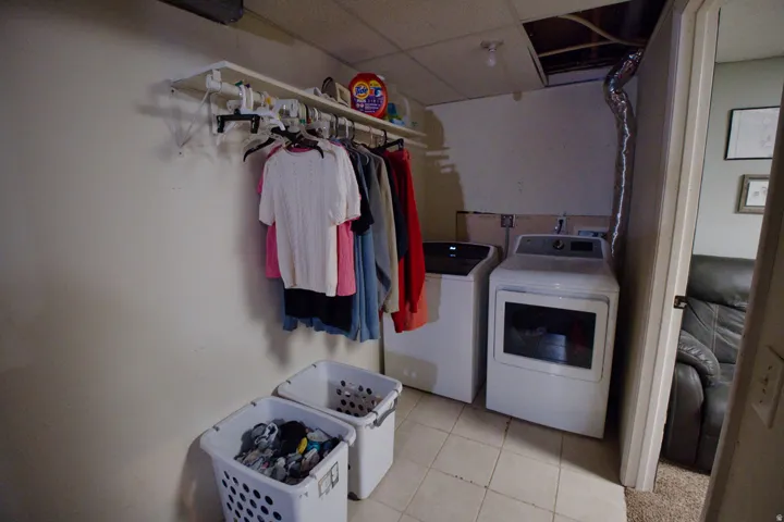 Tile flooring with contemporary washer and dryer appliances