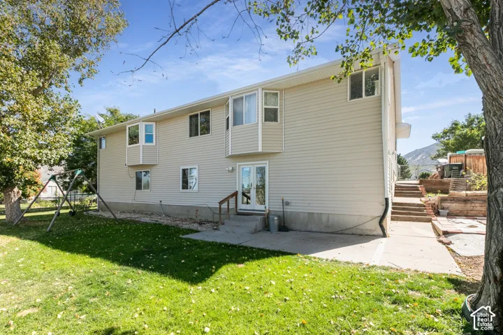 Beige siding exterior with multiple windows