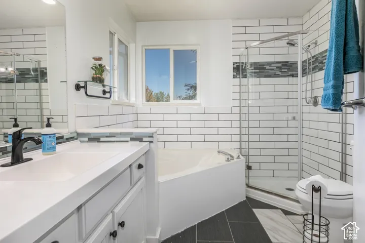 White subway tile accents with a decorative tile band