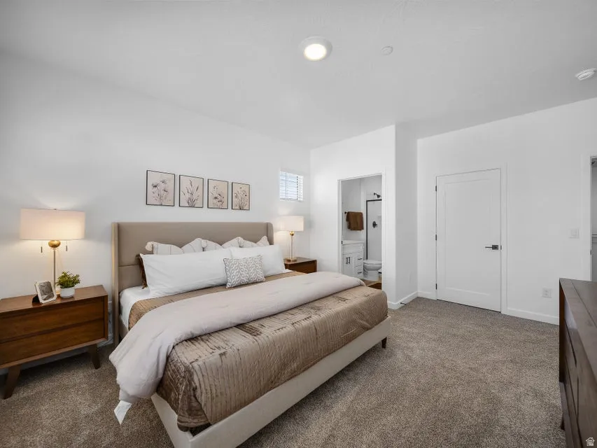 Plush carpet flooring, recessed ceiling lighting, and crisp white walls
