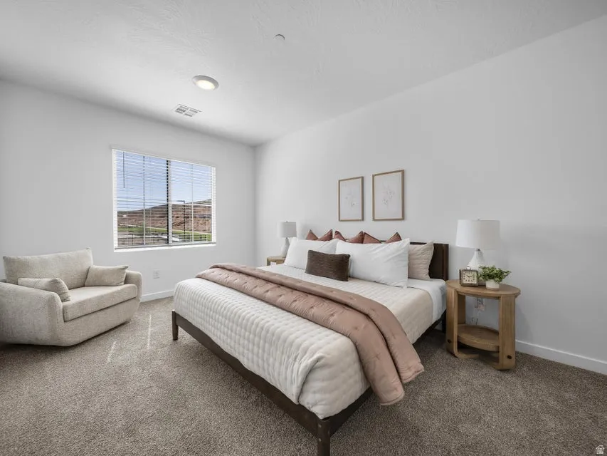 Wall-to-wall carpeting and white walls