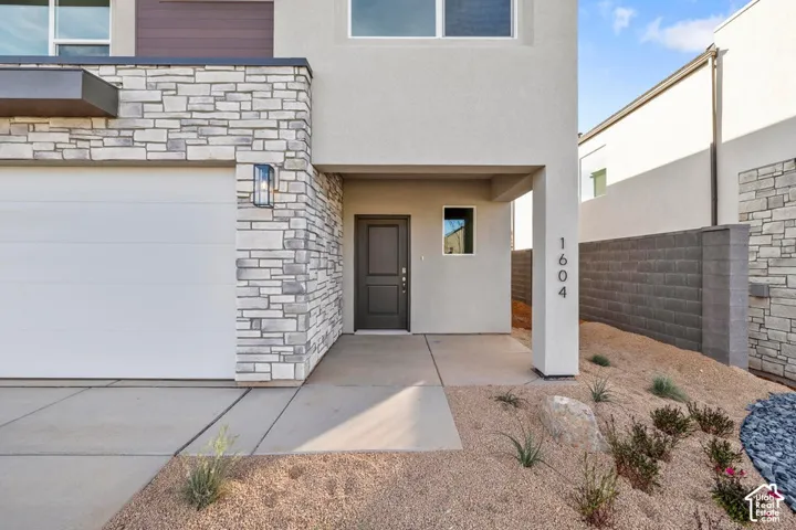 Modern exterior showcasing stone veneer and stucco finishes