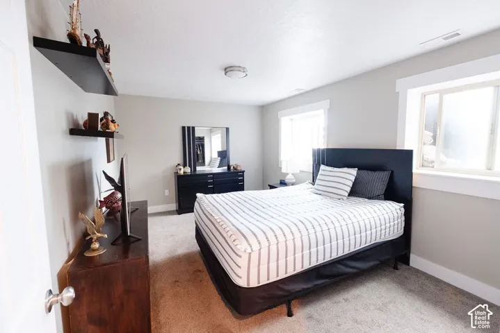Carpeted flooring with light-colored walls and white trim